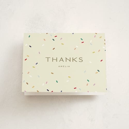 This is a cream kids thank you cards with standard by Ellen Schlegelmilch called tiny bold sprinkles printing on strathmore in standard