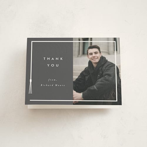 This is a charcoal graduation thank you cards with standard by AK Graphics called tassel framed printing on strathmore in standard