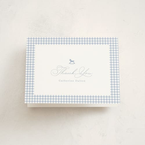 This is a baby blue baby shower thank you cards with standard by Olivia Raufman called gingham rockinghorse printing on strathmore in standard