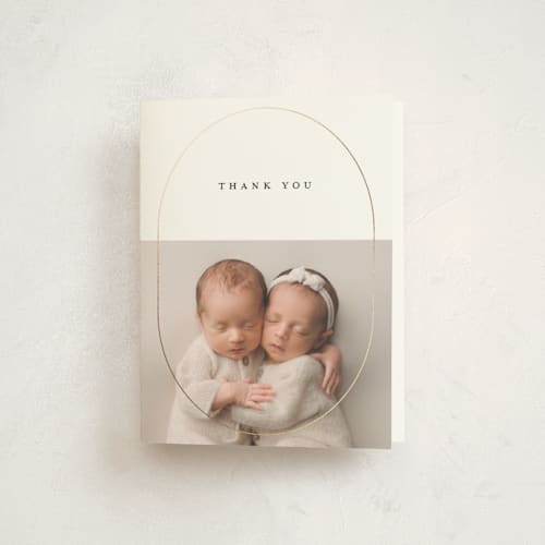 This is a cotton baby thank you cards with foil pressed by Stacy Maalouf called oval announcement printing on strathmore in standard