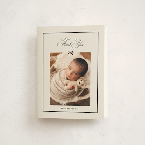 This is a charcoal baby thank you cards with standard by Chelsea Petaja called elegant bow holiday printing on strathmore in standard