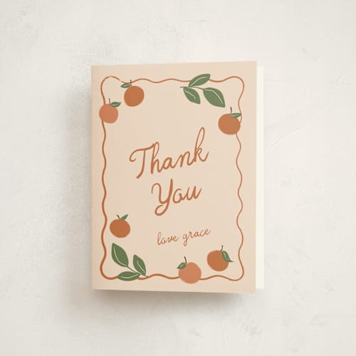 This is a peach baby shower thank you cards with standard by Kelly Watkins called a little cutie printing on strathmore in standard