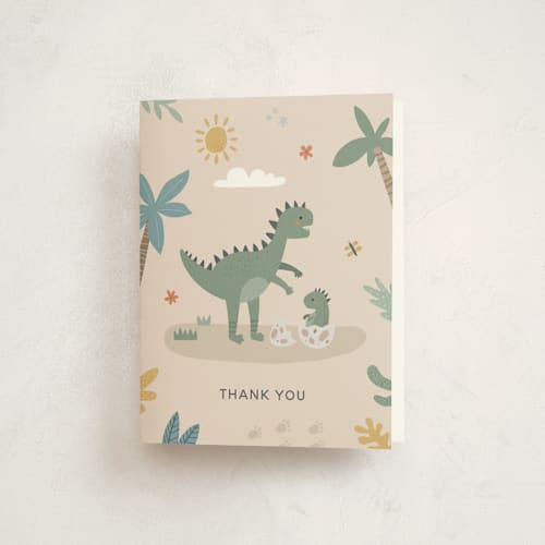 This is a tan baby shower thank you cards with standard by Britt called baby dino printing on strathmore in standard