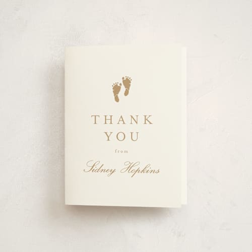 This is a golden baby shower thank you cards with standard by Stacey Meacham called footprint printing on strathmore in standard