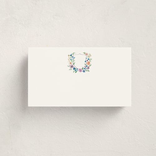 This is a lavender blank hosting stationery with standard by Cass Loh called wildflowers crest printing on signature in placecard