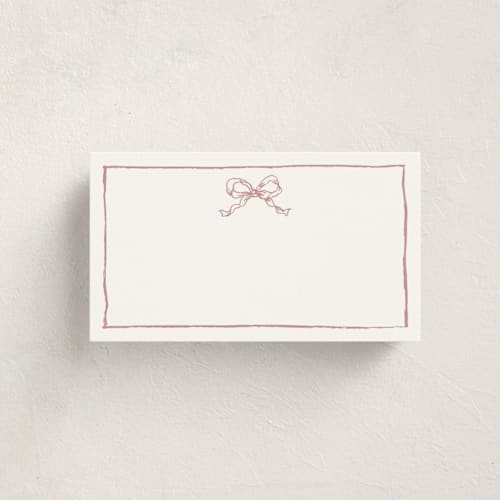 This is a dusty pink blank hosting stationery with standard by Cass Loh called ribbon bow drawing printing on signature in placecard