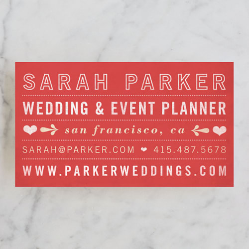 This is a cherry red business cards by June Letters Studio called hearts printing on signature in standard