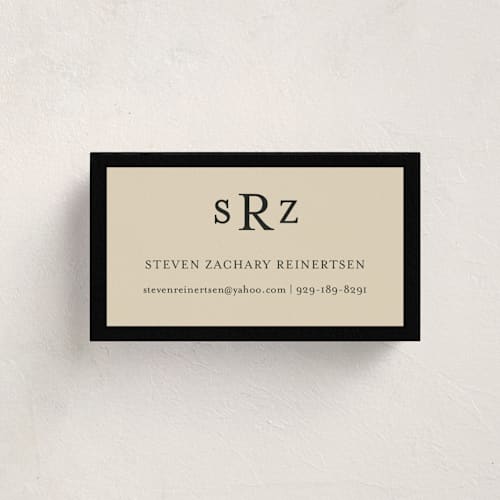 This is a black and tan business cards by Ani Somi called theodore printing on signature in standard