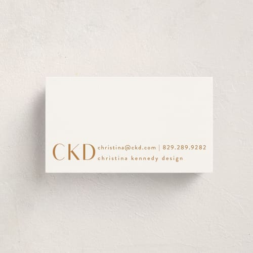 This is a golden business cards by Angela Garrick called monogram corner printing on signature in standard
