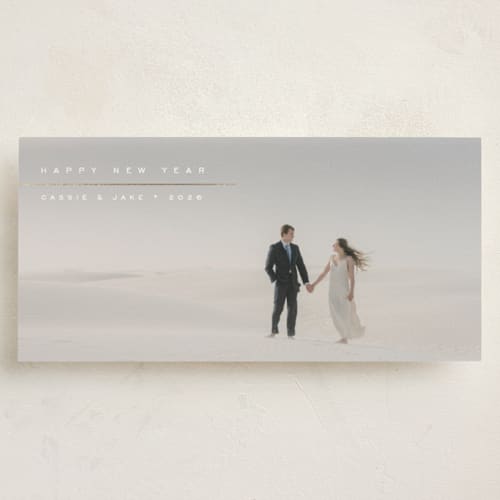 This is a snow foil pressed holiday cards with foil pressed by Olivia Raufman called visage printing on recycled smooth signature in tall