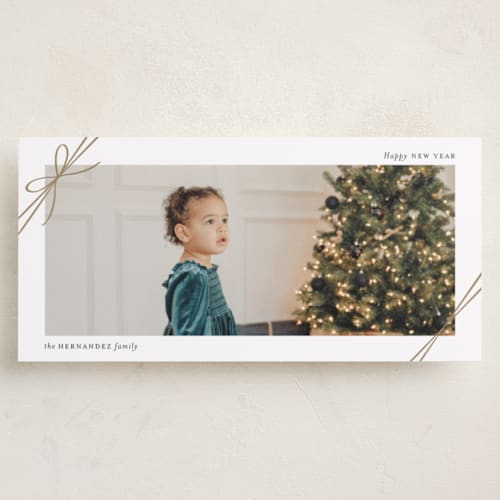 This is a snow holiday photo cards with standard by Heather Schertzer called tied with ribbon printing on recycled smooth signature in tall
