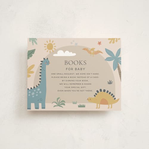 This is a tan baby shower insert cards with standard by Britt called baby dino printing on signature in standard