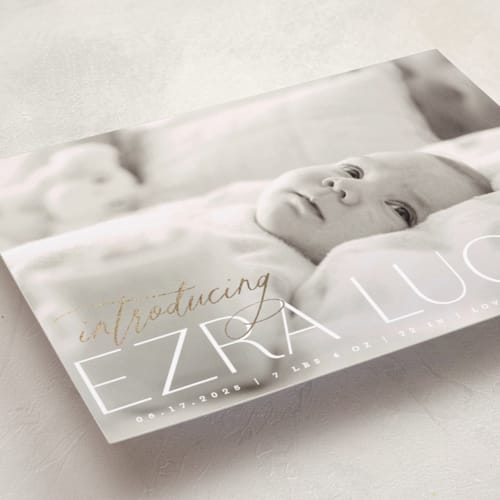 This is a ice foil stamped birth announcements with foil pressed by Everett Paper Goods called flourished printing on smooth signature in standard