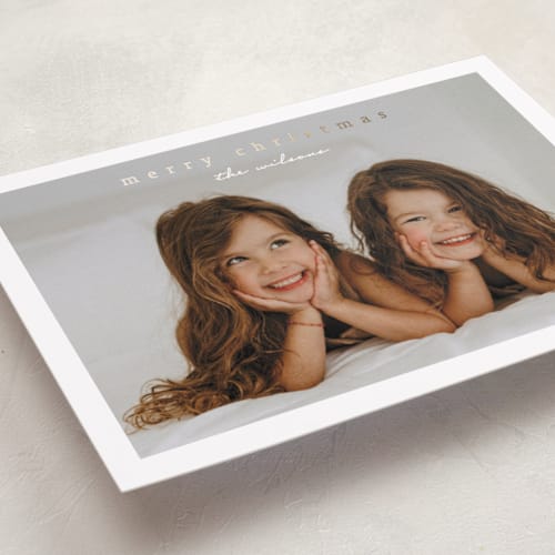 This is a snow foil pressed holiday cards with foil pressed by Stacey Meacham called simplest border printing on recycled smooth signature in standard