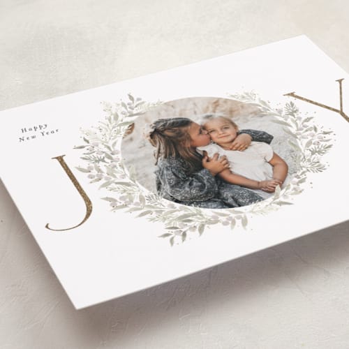 This is a sage foil pressed holiday cards with foil pressed by Itsy Belle Studio called joy wreath printing on recycled smooth signature in standard