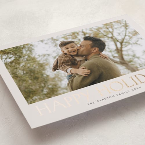 This is a parchment foil pressed holiday cards with foil pressed by Nicole Walsh called headliner printing on recycled smooth signature in standard