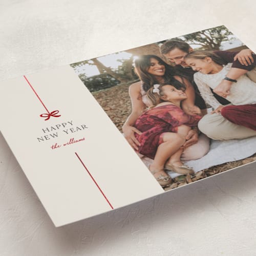 This is a poinsettia foil pressed holiday cards with foil pressed by Pixel and Hank called bow printing on recycled smooth signature in standard