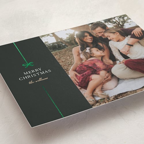 This is a jade foil pressed holiday cards with foil pressed by Pixel and Hank called bow printing on recycled smooth signature in standard