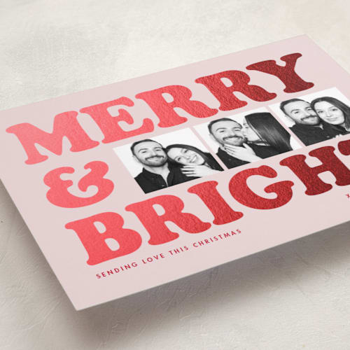 This is a candy foil pressed holiday cards with foil pressed by Snow and Ivy called big type trio printing on recycled smooth signature in standard