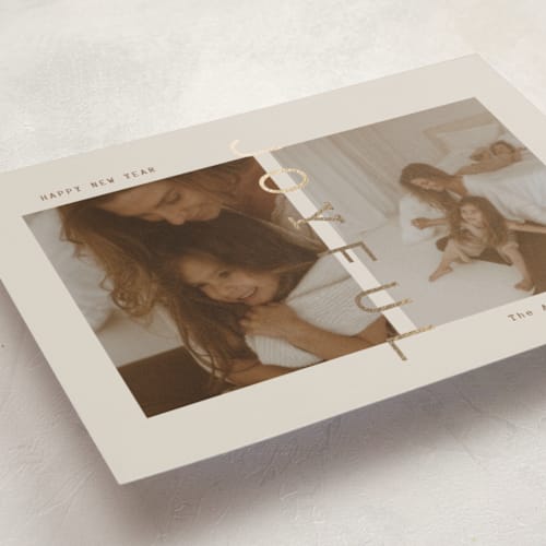 This is a linen foil pressed holiday cards with foil pressed by Ana Sharpe called joyful den printing on recycled smooth signature in standard