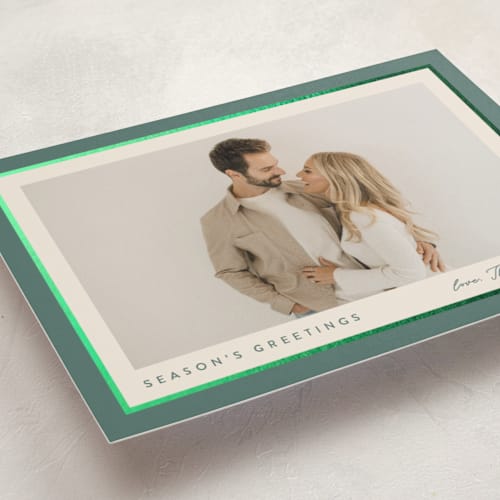 This is a holly sprig foil pressed holiday cards with foil pressed by Carolyn MacLaren called ribbon frame printing on recycled smooth signature in standard