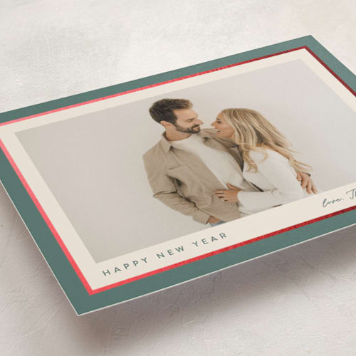 This is a holly sprig foil pressed holiday cards with foil pressed by Carolyn MacLaren called ribbon frame printing on recycled smooth signature in standard
