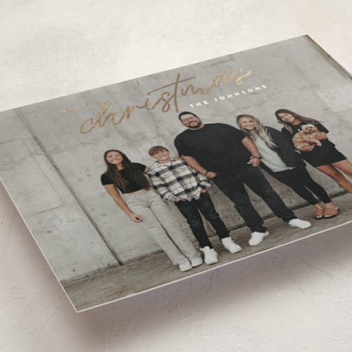 This is a snow foil pressed holiday cards with foil pressed by Ekko Studio called merry monoline printing on recycled smooth signature in standard