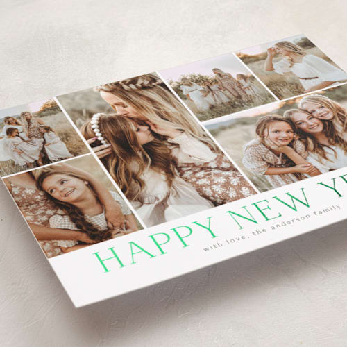 This is a sage foil pressed holiday cards with foil pressed by Kimberly Morgan called holiday photo grid printing on recycled smooth signature in standard