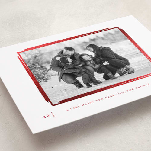 This is a cranberry foil pressed holiday cards with foil pressed by That Girl Press called gilded frame printing on recycled smooth signature in standard