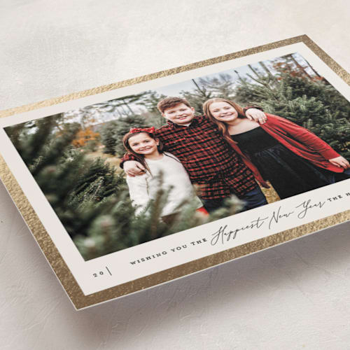 This is a ivory foil pressed holiday cards with foil pressed by Carolyn Nicks called frame printing on recycled smooth signature in standard