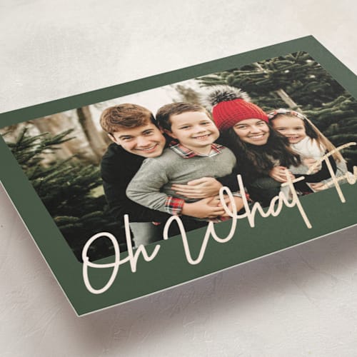 This is a forest foil pressed holiday cards with foil pressed by Karidy Walker called oh what fun script printing on recycled smooth signature in standard