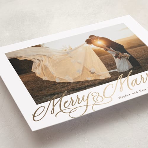 This is a cinnamon foil pressed holiday cards with foil pressed by Hooray Creative called elegantly married printing on recycled smooth signature in standard