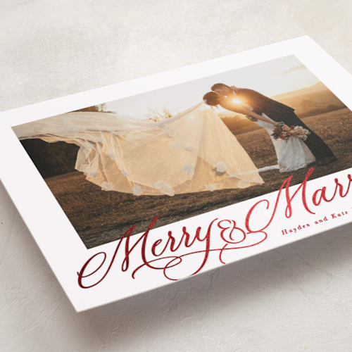 This is a poinsettia foil pressed holiday cards with foil pressed by Hooray Creative called elegantly married printing on recycled smooth signature in standard