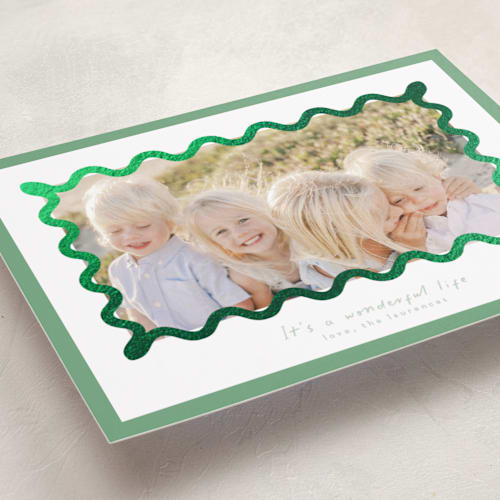This is a spearmint foil pressed holiday cards with foil pressed by Blustery August called party squiggle printing on recycled smooth signature in standard
