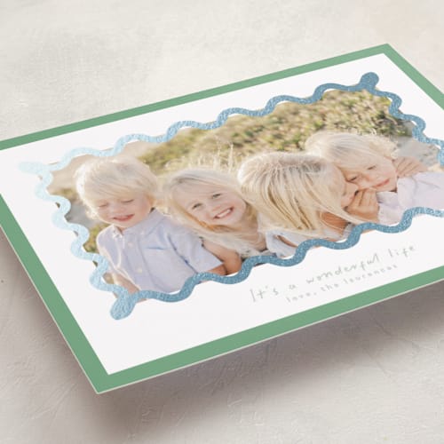 This is a spearmint foil pressed holiday cards with foil pressed by Blustery August called party squiggle printing on recycled smooth signature in standard
