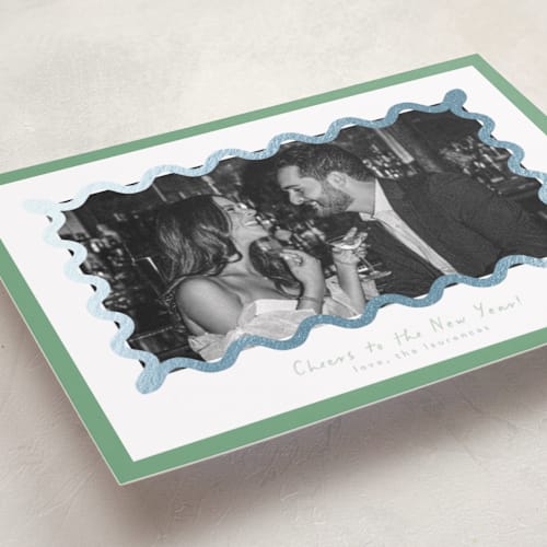 This is a spearmint foil pressed holiday cards with foil pressed by Blustery August called party squiggle printing on recycled smooth signature in standard