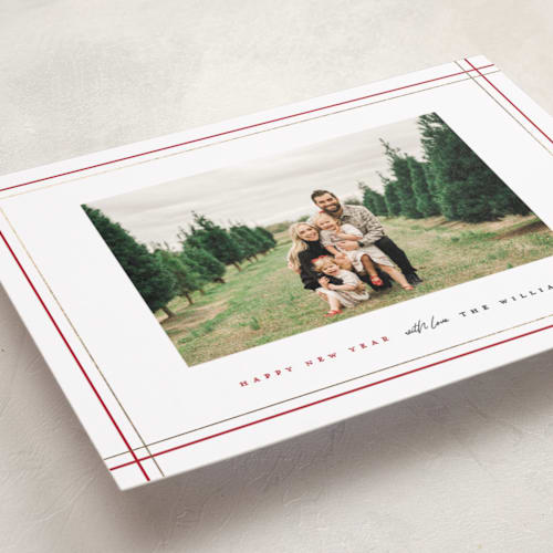 This is a holly foil pressed holiday cards with foil pressed by Pixel and Hank called with love printing on recycled smooth signature in standard