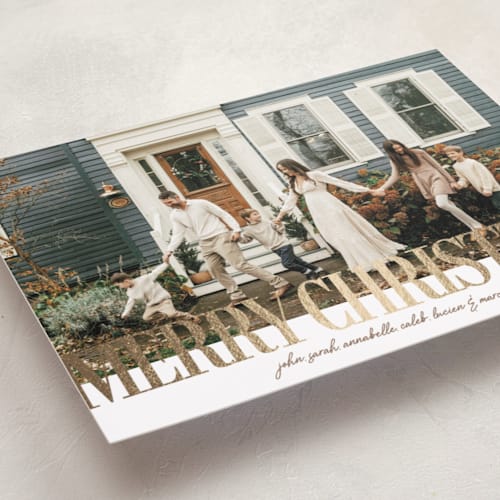 This is a almond foil pressed holiday cards with foil pressed by Kelly Watkins called headline printing on recycled smooth signature in standard