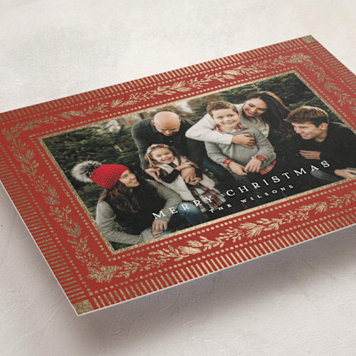 This is a cranberry foil pressed holiday cards with foil pressed by Laura Hankins called gilt greens printing on recycled smooth signature in standard
