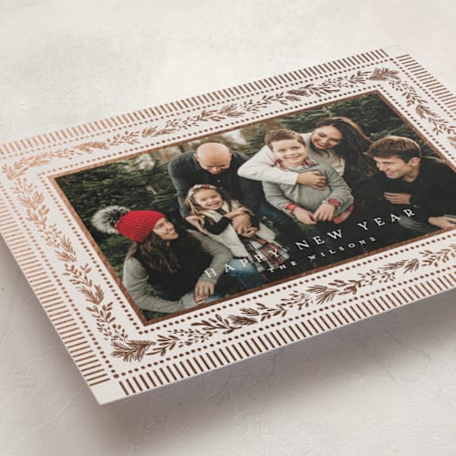 This is a marshmallow foil pressed holiday cards with foil pressed by Laura Hankins called gilt greens printing on recycled smooth signature in standard