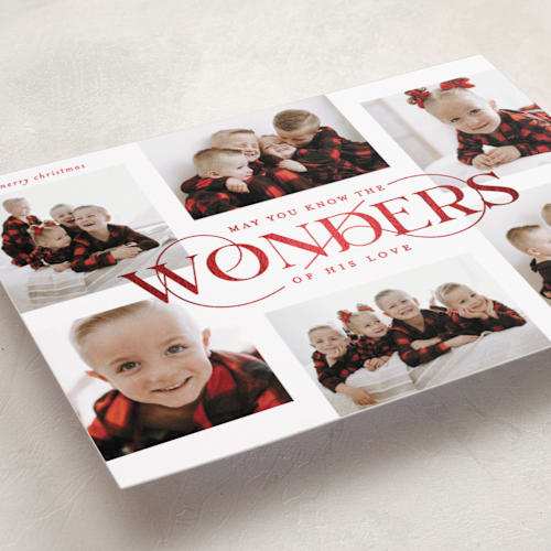 This is a ruby foil pressed holiday cards with foil pressed by Lauren Chism called glorious wonders printing on recycled smooth signature in standard