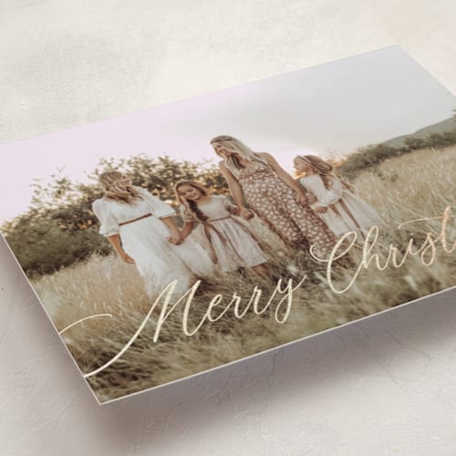 This is a coal foil pressed holiday cards with foil pressed by Kelly Schmidt called scripted merry christmas printing on recycled smooth signature in standard