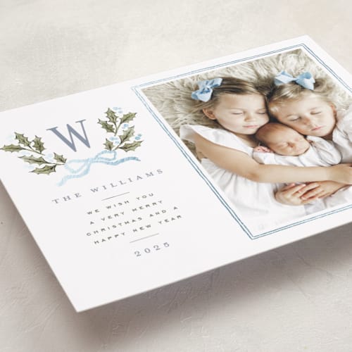 This is a blue spruce foil pressed holiday cards with foil pressed by Wildfield Paper Co called holly monogram printing on recycled smooth signature in standard