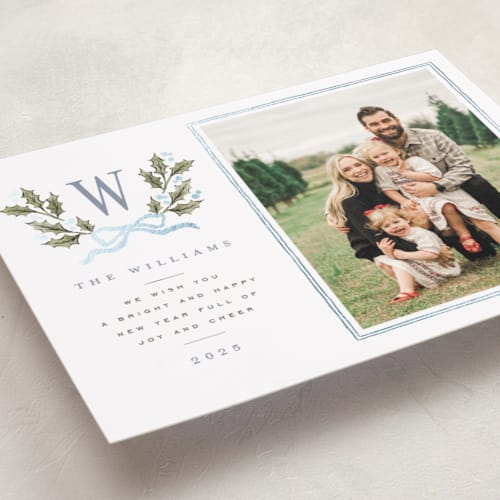 This is a blue spruce foil pressed holiday cards with foil pressed by Wildfield Paper Co called holly monogram printing on recycled smooth signature in standard