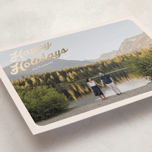 This is a buttercream foil pressed holiday cards with foil pressed by Morgan Kendall called vintage postcard printing on recycled smooth signature in standard