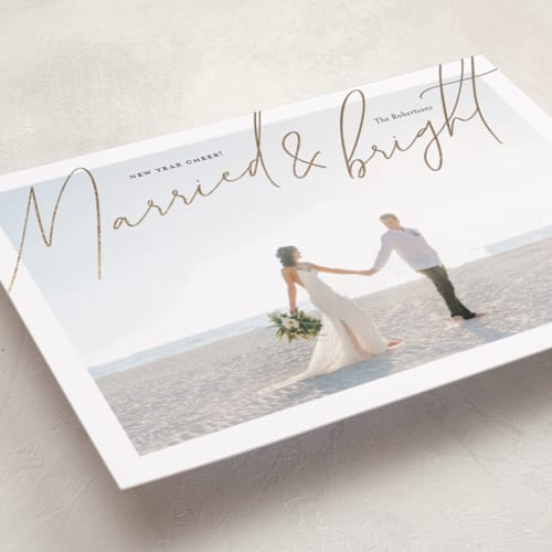 This is a gilded foil pressed holiday cards with foil pressed by Shari Margolin called shining newlyweds printing on recycled smooth signature in standard