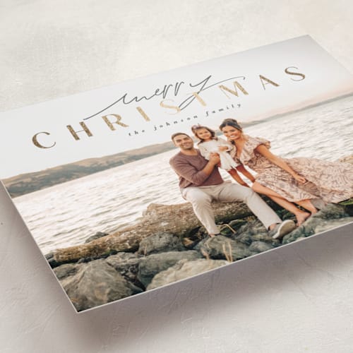 This is a frosted pines foil pressed holiday cards with foil pressed by Design Lotus called minimalist holiday glow printing on recycled smooth signature in standard