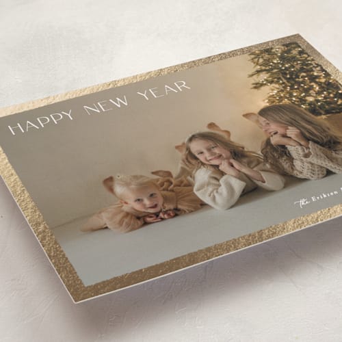 This is a sugar foil pressed holiday cards with foil pressed by Hooray Creative called gilded border printing on recycled smooth signature in standard