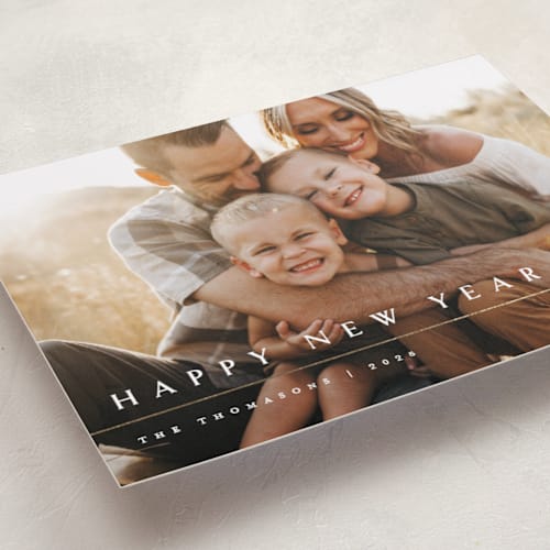 This is a snowfall foil pressed holiday cards with foil pressed by Melanie Kosuge called minimalist printing on recycled smooth signature in standard