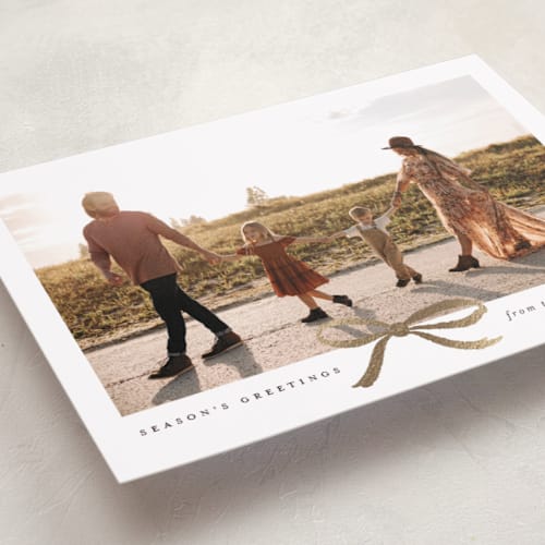 This is a hot cocoa foil pressed holiday cards with foil pressed by Olivia Kanaley Inman called crimson bow printing on recycled smooth signature in standard